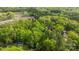 An aerial view of the property reveals a densely wooded lot with two homesites visible on the grounds at 1676 Partridge Cir, Lancaster, SC 29720