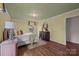 Serene bedroom features hardwood floors, a comfortable bed, and ample natural light, offering a tranquil escape at 1676 Partridge Cir, Lancaster, SC 29720