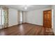 Bright bedroom with hardwood floors, natural light, and a spacious layout at 1676 Partridge Cir, Lancaster, SC 29720