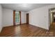 Well-lit bedroom offers hardwood floors, ample closet space, and neutral walls at 1676 Partridge Cir, Lancaster, SC 29720