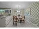 Charming breakfast nook features a round table with seating for four, and a bright window at 1676 Partridge Cir, Lancaster, SC 29720
