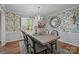 Elegant dining room featuring wainscoting, hardwood floors, and a chandelier at 1676 Partridge Cir, Lancaster, SC 29720