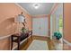 Inviting foyer featuring a decorative table with a lamp, hardwood floors, and a view of the living area at 1676 Partridge Cir, Lancaster, SC 29720