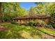 Charming brick home with mature trees, landscaping, and a well-maintained front lawn at 1676 Partridge Cir, Lancaster, SC 29720