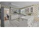 Functional kitchen features white tile countertops, ample storage, and a cozy dining area nearby, ideal for cooking at 1676 Partridge Cir, Lancaster, SC 29720