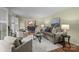 Cozy living room boasts neutral tones, plush seating, and a view into the dining area, perfect for relaxation at 1676 Partridge Cir, Lancaster, SC 29720