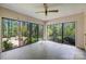 Bright sunroom with panoramic windows, offering serene views of the surrounding greenery, perfect for relaxation at 1676 Partridge Cir, Lancaster, SC 29720
