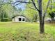 Large backyard with lush green grass and a storage shed at 1780 Short St, Mount Pleasant, NC 28124