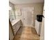 Bathroom featuring a vanity, mirror, and combination washer/dryer at 1780 Short St, Mount Pleasant, NC 28124