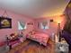 Vibrant bedroom with bright walls, decorative accents, and cheerful ambiance at 1780 Short St, Mount Pleasant, NC 28124