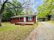 Charming brick home with a well-manicured lawn and covered parking at 1780 Short St, Mount Pleasant, NC 28124
