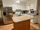 Bright kitchen with white cabinets, stainless steel refrigerator, and center island at 1780 Short St, Mount Pleasant, NC 28124