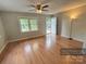 Bright living room featuring wood floors, large windows, and an open layout at 1780 Short St, Mount Pleasant, NC 28124