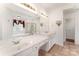 Bright bathroom with double sinks, ample counter space, and a walk-in closet at 1801 Briarcrest Nw Dr, Charlotte, NC 28269