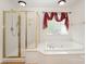 Well-lit bathroom with a glass-enclosed shower and a large soaking tub under a window at 1801 Briarcrest Nw Dr, Charlotte, NC 28269