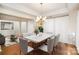 Elegant dining room featuring a stylish chandelier and ample space for Gathering gatherings and formal dinners at 1801 Briarcrest Nw Dr, Charlotte, NC 28269