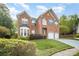 Beautiful brick home with a well-maintained lawn, lovely landscaping, and a two-car attached garage at 1801 Briarcrest Nw Dr, Charlotte, NC 28269