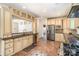 Traditional kitchen boasts stainless appliances, stone tile floors, granite countertops, and wooden cabinets at 1801 Briarcrest Nw Dr, Charlotte, NC 28269