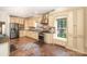 Traditional kitchen offers stainless appliances, stone tile floors, granite countertops, and wooden cabinets at 1801 Briarcrest Nw Dr, Charlotte, NC 28269