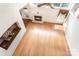 Spacious living room with hardwood floors, fireplace, large windows, and natural light from above at 1801 Briarcrest Nw Dr, Charlotte, NC 28269
