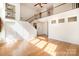 Open living room with hardwood floors, a staircase, a second floor balcony and lots of natural light at 1801 Briarcrest Nw Dr, Charlotte, NC 28269