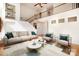 Spacious living room with high ceilings, a staircase, and large windows that flood the space with natural light at 1801 Briarcrest Nw Dr, Charlotte, NC 28269
