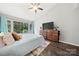 Bright bedroom with a large window, hardwood floors, and a ceiling fan at 181 Riverview Ter, Clover, SC 29710