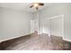 Spacious bedroom featuring hardwood floors, ample closet space, and a ceiling fan at 181 Riverview Ter, Clover, SC 29710