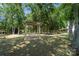 Serene community area with a wooden swing set, picnic tables, and mature trees offering a peaceful outdoor gathering space at 181 Riverview Ter, Clover, SC 29710