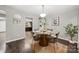 Charming dining area with rustic wood floors, a modern light fixture, and stylish decor at 181 Riverview Ter, Clover, SC 29710