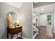 Entryway view shows stairway and decoratively appointed console table near the front door at 181 Riverview Ter, Clover, SC 29710