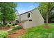 Charming home featuring verdant landscaping and neutral siding, nestled amongst mature trees at 181 Riverview Ter, Clover, SC 29710