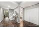 Inviting foyer with wood floors, staircase, console table, mirror, closet and view to living space at 181 Riverview Ter, Clover, SC 29710