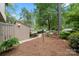 Tranquil yard with lush greenery, flower beds, pine straw, and a stone path leading to the property at 181 Riverview Ter, Clover, SC 29710