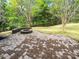 Inviting backyard with stone paver patio and a cozy fire pit perfect for outdoor entertaining at 1907 Caprington Dr, Fort Mill, SC 29707