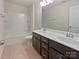 Bathroom featuring a double sink vanity, a bathtub and shower combination, with tile flooring throughout at 1907 Caprington Dr, Fort Mill, SC 29707