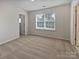 Bedroom with plush neutral carpet, bright windows, and a spacious layout at 1907 Caprington Dr, Fort Mill, SC 29707