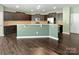 Spacious kitchen with dark cabinetry, granite countertops, and modern appliances at 1907 Caprington Dr, Fort Mill, SC 29707