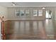 Bright and spacious living room with multiple windows and access to the backyard at 1907 Caprington Dr, Fort Mill, SC 29707