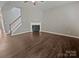 Open living room with a fireplace and hardwood floors, perfect for entertaining at 1907 Caprington Dr, Fort Mill, SC 29707