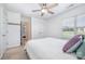Bright bedroom has a ceiling fan and a hallway to an attached bathroom at 2003 Ptarmigan Ct, Waxhaw, NC 28173