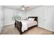 Bedroom with neutral walls, carpet flooring, and natural light from a window at 2003 Ptarmigan Ct, Waxhaw, NC 28173