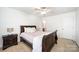 Bedroom with neutral walls, carpet flooring, and natural light from a window at 2003 Ptarmigan Ct, Waxhaw, NC 28173
