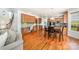 Open floor plan with kitchen featuring wood cabinets, granite counters, and adjacent breakfast area at 2003 Ptarmigan Ct, Waxhaw, NC 28173