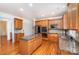 Traditional kitchen featuring wood cabinets, granite countertops, stainless steel appliances, and a center island at 2003 Ptarmigan Ct, Waxhaw, NC 28173