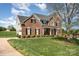 Beautiful brick home with lush landscaping and inviting curb appeal at 2003 Ptarmigan Ct, Waxhaw, NC 28173