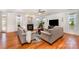 Cozy living room with hardwood floors, fireplace, and plenty of natural light at 2003 Ptarmigan Ct, Waxhaw, NC 28173