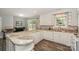 Kitchen with white cabinets, stylish marble countertops, and stainless steel appliances at 22025 Torrence Chapel Rd, Cornelius, NC 28031