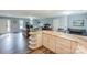 Open kitchen with a large island, white cabinets, marble countertops, and stainless steel appliances at 22025 Torrence Chapel Rd, Cornelius, NC 28031