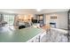 Spacious open-concept living area with hardwood floors, a view of the kitchen, and lots of light at 22025 Torrence Chapel Rd, Cornelius, NC 28031